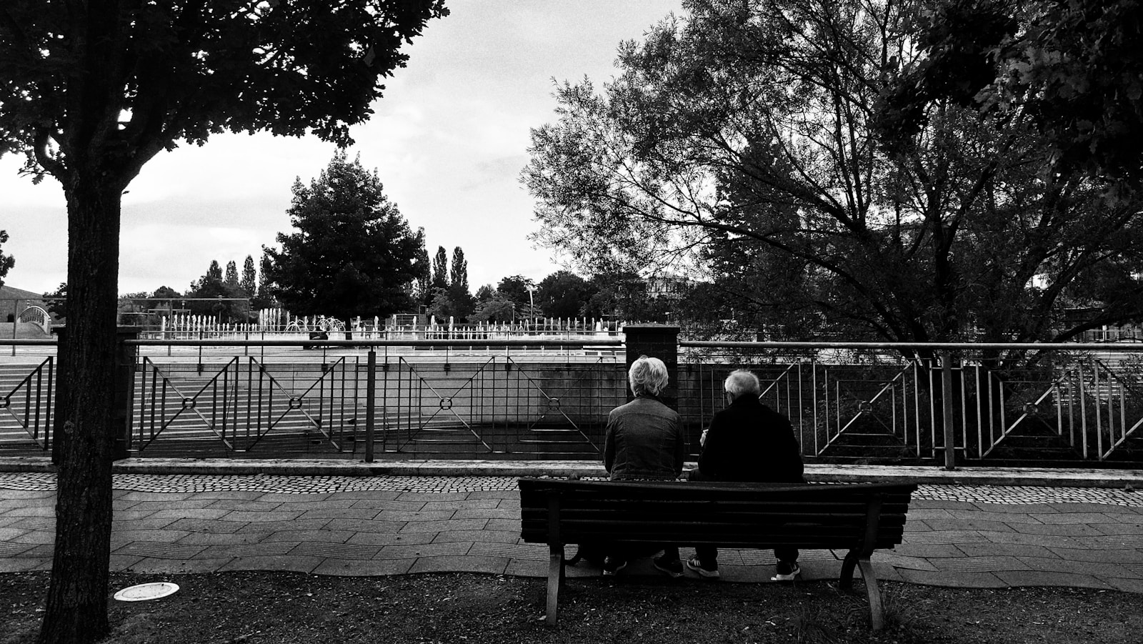 a couple sitting on a bench